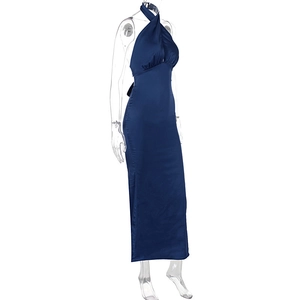 Detail of navy blue satin evening dress featuring high slit and halter neck design