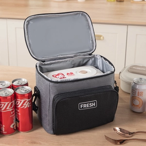 Gray insulated lunch bag with thick aluminum foil lining and a durable shoulder strap