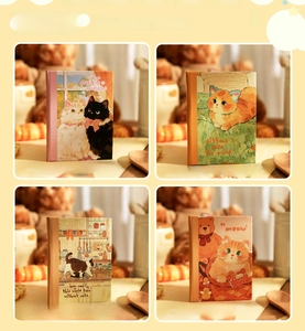 Set of four A7 size notebooks featuring original warm cat themed artistic illustrations