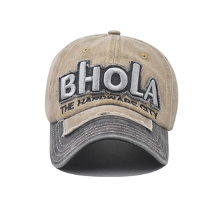 Close-up of BHOLA 3D embroidery and distressed brim on vintage trucker cap
