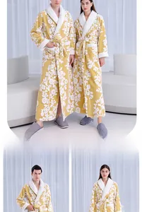 Detailed close-up of yellow floral plush bathrobe with thick collar and fleece cuffs