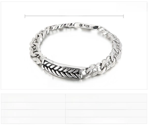 Macro detail of men's stainless steel bracelet with wheat pattern and dimensions