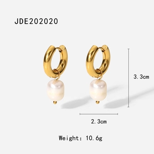 Detail of 18K gold stainless steel earrings with baroque freshwater pearl pendants