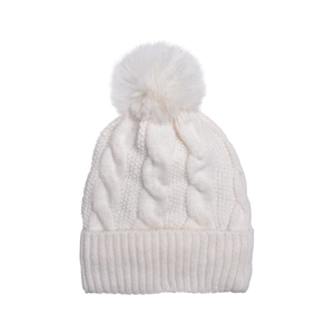 Detailed cable knit pattern on white winter beanie with fluffy pom-pom and ribbed brim