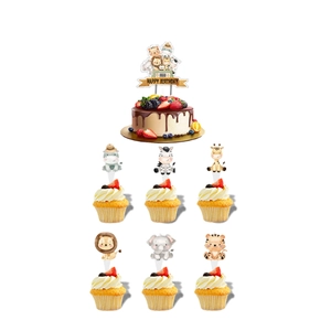 Detailed view of safari jungle animal themed cake toppers with cartoon lions and elephants