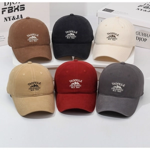 Detail view showing a variety of vintage washed cotton baseball caps in six different colors