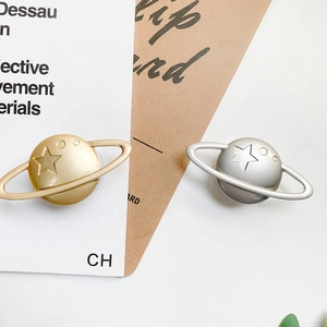 Saturn shaped telescopic phone socket stand in metallic gold and silver star design