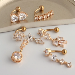 Set of gold stainless steel belly button rings with white zircon heart and butterfly charms
