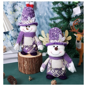 Detail of Christmas reindeer doll with purple sequins and snowflake pattern textures