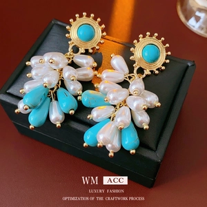 Vintage gold drop earrings with turquoise beads and waterdrop pearls on black box