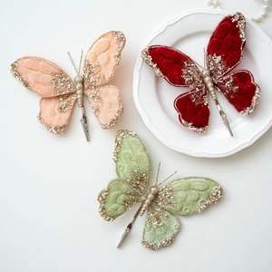 Three elegant fabric butterfly clips in pink, red, and green for Christmas tree decor