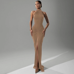 Detail of camel halter dress showing pleated waist and thigh-high side slit