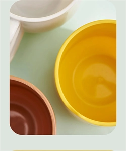 Top-down view showing the smooth interior and rim of three colorful cartoon tooth cups