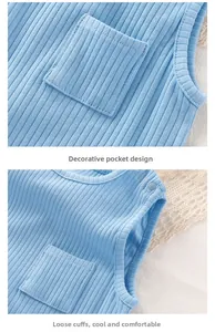 Close-up of baby romper with ribbed knit texture, decorative pocket and shoulder buttons