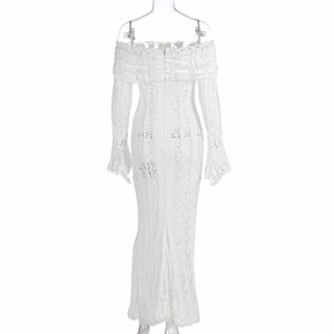 Detail of white lace off-shoulder dress with trumpet sleeves and floral hollow patterns