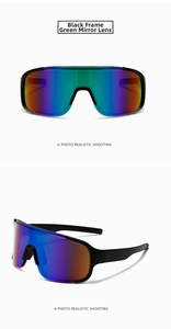 Detail of sports cycling sunglasses with black frame and green mirrored gradient lenses
