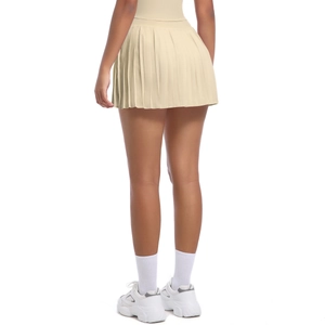 Rear view of light beige pleated tennis skirt with high waist design and activewear fabric