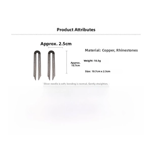 Detail view of black tassel earrings with rhinestones showing dimensions 10.7cm by 2.5cm
