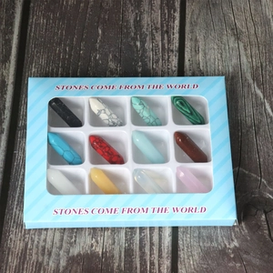 Set of 12 hexagonal natural stone crystal pendants in a striped blue gift display box