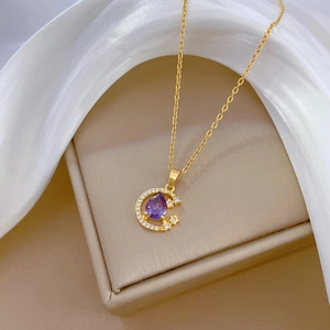 Golden titanium moon necklace with purple water drop gem and sparkling crystals