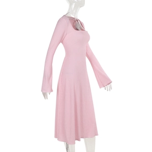 Close-up of pink long-sleeved square neck dress showing fine ribbed knit fabric texture
