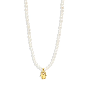 Detail of S925 silver pearl necklace with gold Hamsa Hand pendant and diamond accent