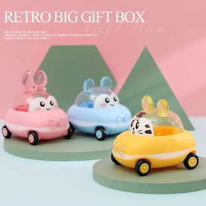 Set of three colorful cartoon wind-up toy cars in pastel pink blue and yellow colors