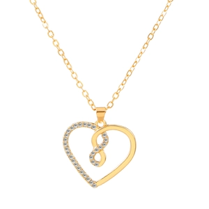 Elegant gold infinity heart necklace with sparkling clear gemstones on a white background