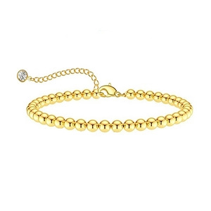 Gold beaded chain bracelet with lobster clasp and a clear sparkling pendant