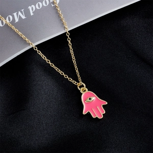 18K gold plated copper necklace with pink enamel Hamsa hand pendant and evil eye detail