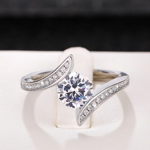 Exquisite silver ring with a round-cut clear gemstone and sparkling side accent stones