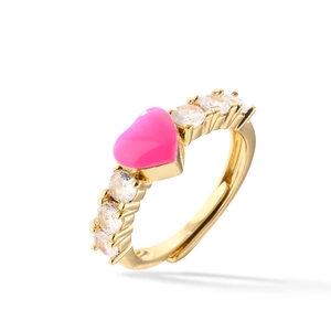 Adjustable gold ring featuring a pink enamel heart and clear zircon side stones