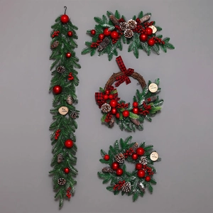 Christmas decoration set with pine cones, red baubles, and Merry Christmas wreaths