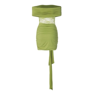 Detail view of green lace patchwork dress featuring tiered ruffles and flowing ribbons