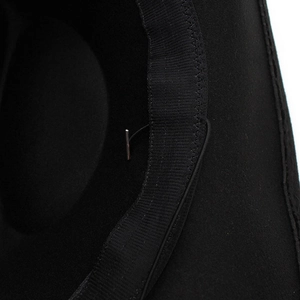 Detail view of the black wool felt hat interior with adjustable drawstring and sweatband