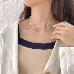 Minimalist 925 sterling silver geometric bead chain necklace worn by a model