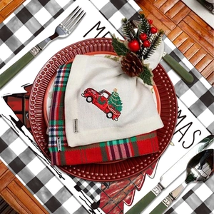 Christmas table mat set with red truck embroidery and classic plaid linen patterns