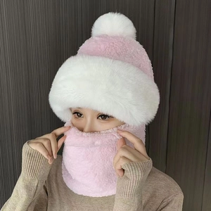 Detail of pink and white plush earflap hat with thick faux fur for winter warmth