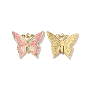 Detailed front and back view of gold butterfly pendants with pink enamel and rhinestones