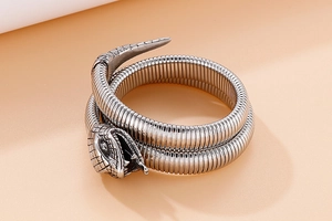 Detailed macro view of retro silver stainless steel snake bracelet with textured scales