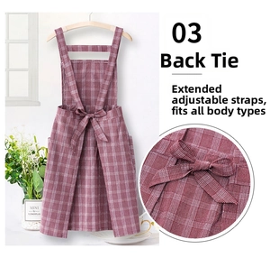 Detail of red checkered cotton apron with adjustable back bow tie and crossover straps