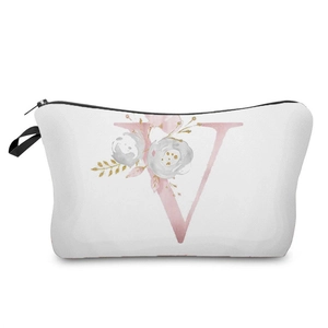 Detailed view of a stylish floral letter V pattern on a white canvas makeup bag