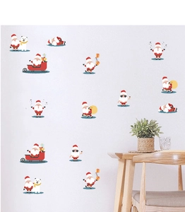 Christmas wall stickers with cartoon Santa Claus and polar bears in a cozy room setting