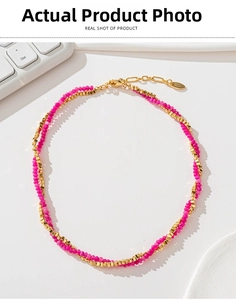 Detail of rose pink faceted crystal beads and gold lobster clasp on double-layered necklace