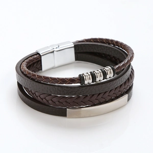 Detail of dark brown braided leather multilayer bracelet with silver magnetic clasp