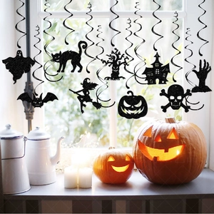 Halloween party decorations featuring black glitter spiral hanging ghost and bat silhouettes