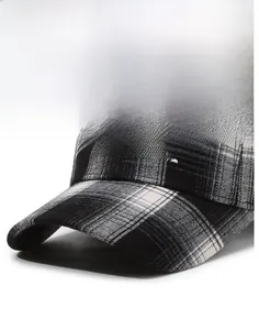 Detail view of black and white plaid baseball cap featuring white 3D letter embroidery
