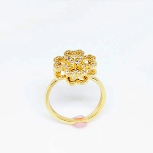 Golden rotating clover ring with micro-set cubic zirconia for women, polished finish