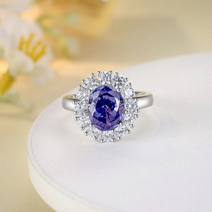 S925 sterling silver ring with oval purple gemstone and brilliant white accent stones