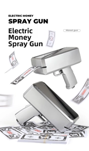 Close-up of electric money spray gun in silver finish with flying prop banknotes